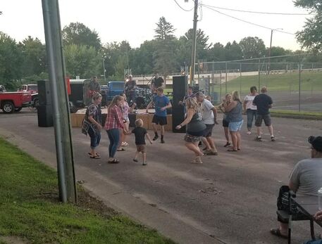 Band performing live in Riverview Park during Music in the Park