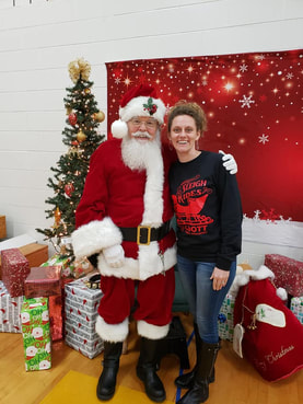 Santa greeting a child during a Cadott holiday event
