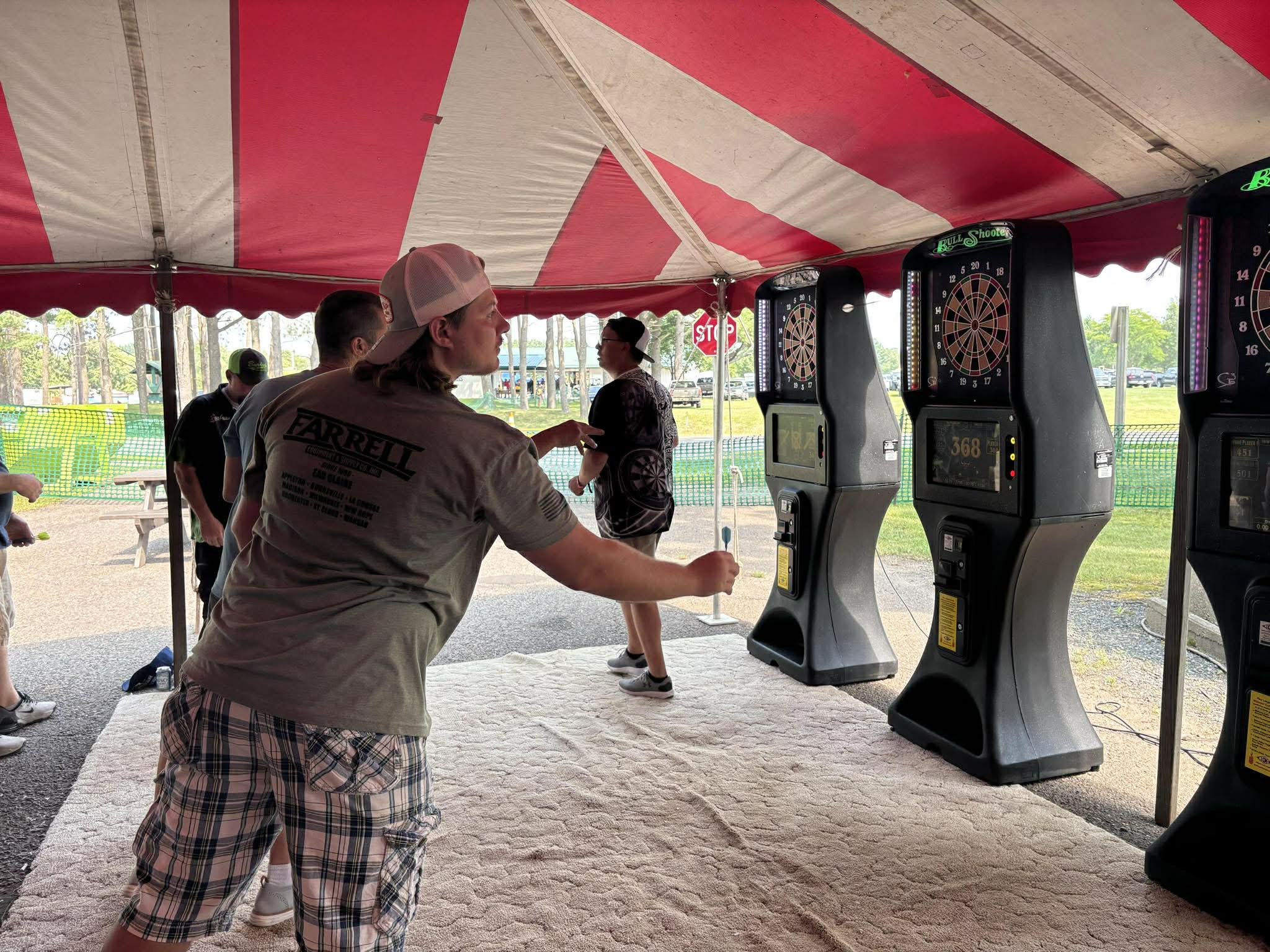 A dart player lines up a throw during the Nabor Days tournament