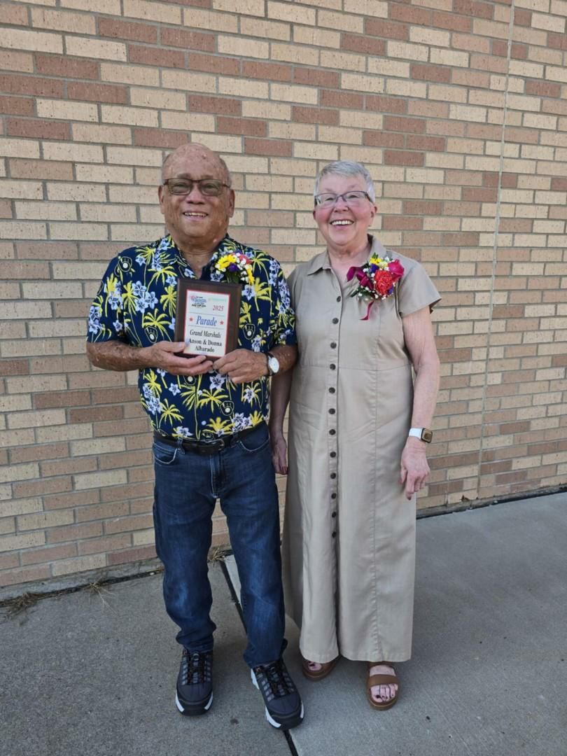 Anson and Donna Alborado, the 2025 Cadott Nabor Days Grand Marshals, holding their plaque